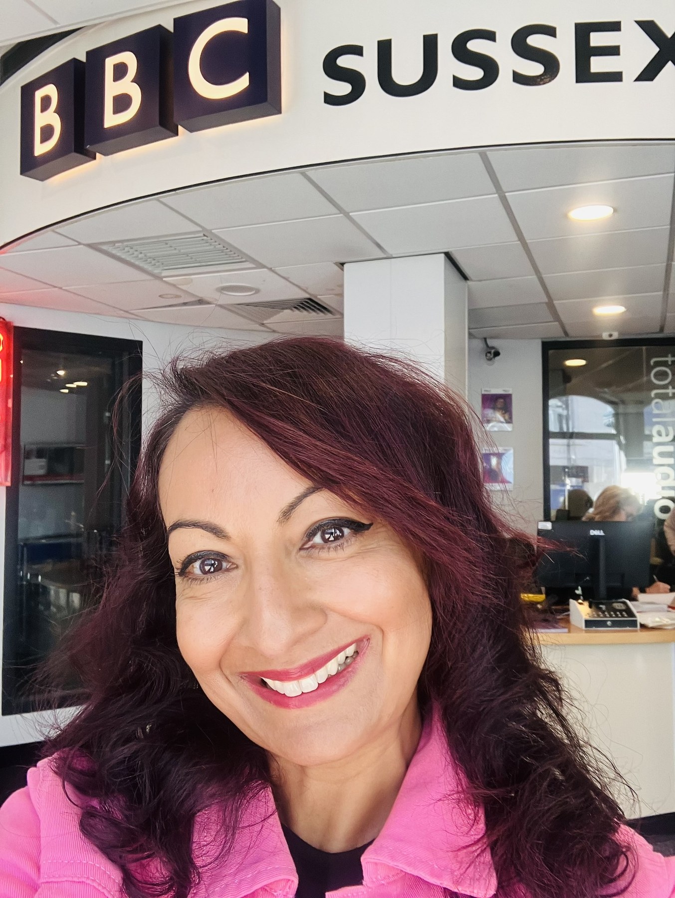 Aneela Rose at BBC Sussex Aneela Rose smiling inside the BBC Sussex studio before her live radio interview